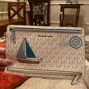 Adorable Michael Kors “jet set go” sail boat wristlet bag. Never used.